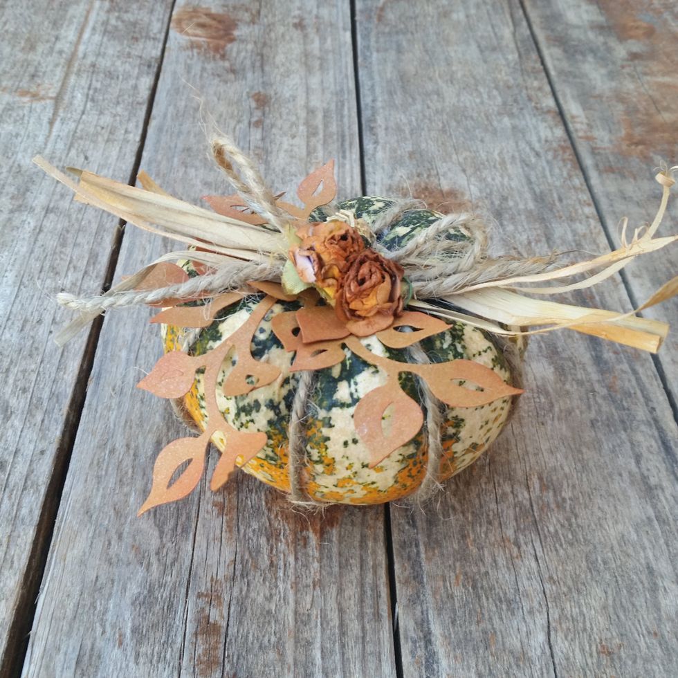 Here is a fun greenish pumpkin. I added extra ivy and raffia, but only 2 flowers to the top.