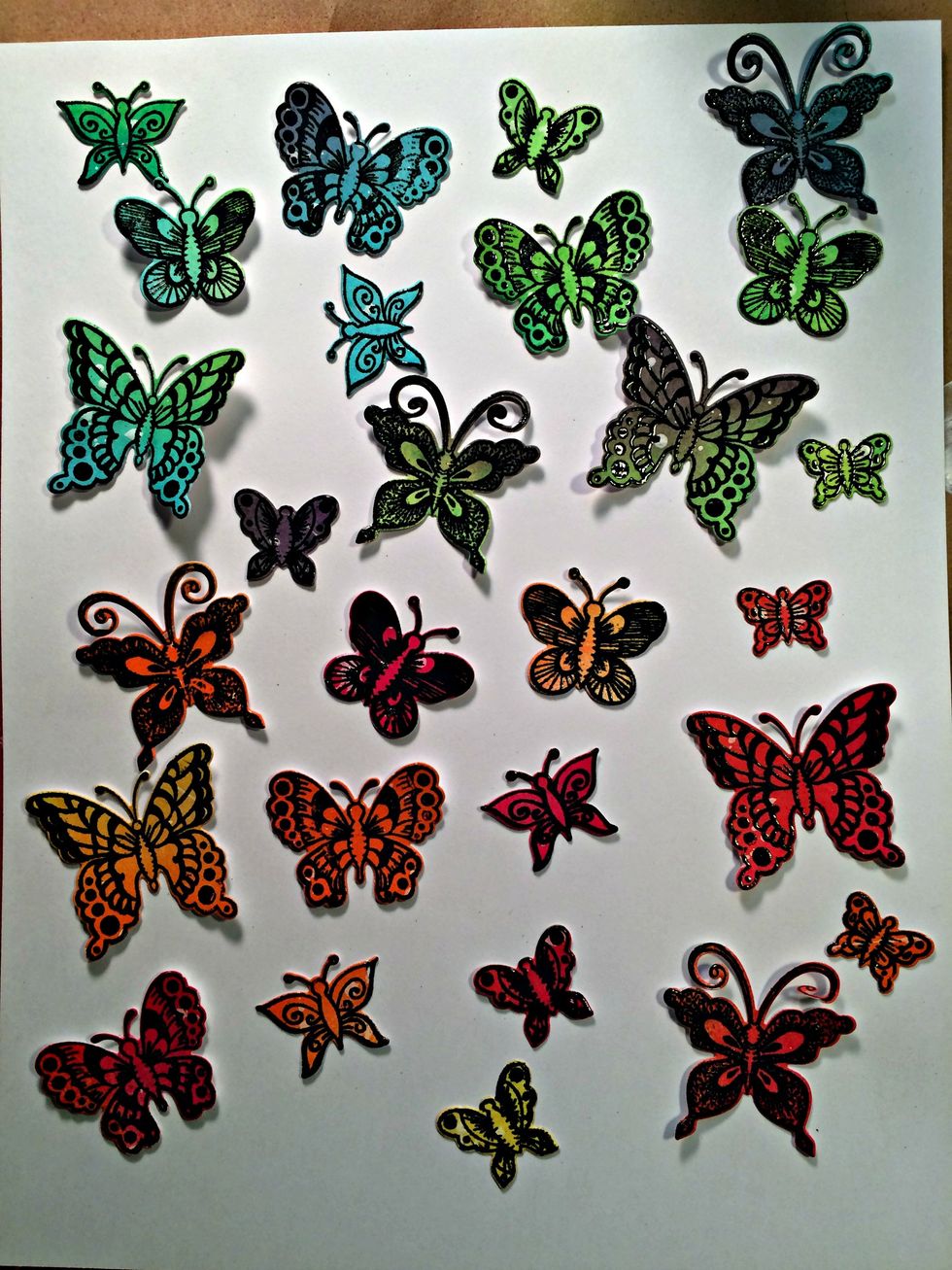 Here is a picture of the butterflies after they have been run through the die. As you can see I also did some in shades of orange and red. I will use these in another project (so stay tuned)