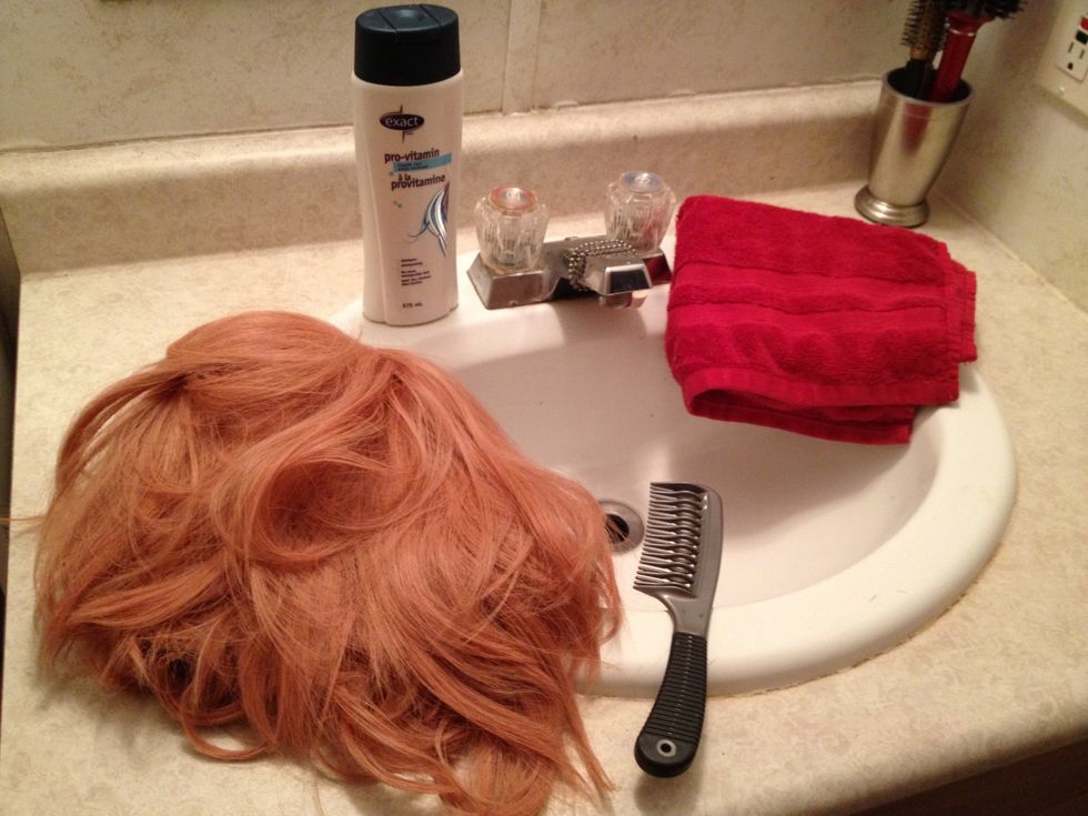 Here is a snapshot of the tools I will be using as well as the wig that I will be using in this demonstration. As you can see its quite messy.