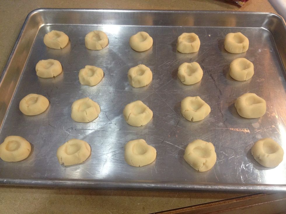 Here is a tricky part...indent the cookies with your finger or a cool doodad and try not to make deep cracks in the sides. Ill show you why