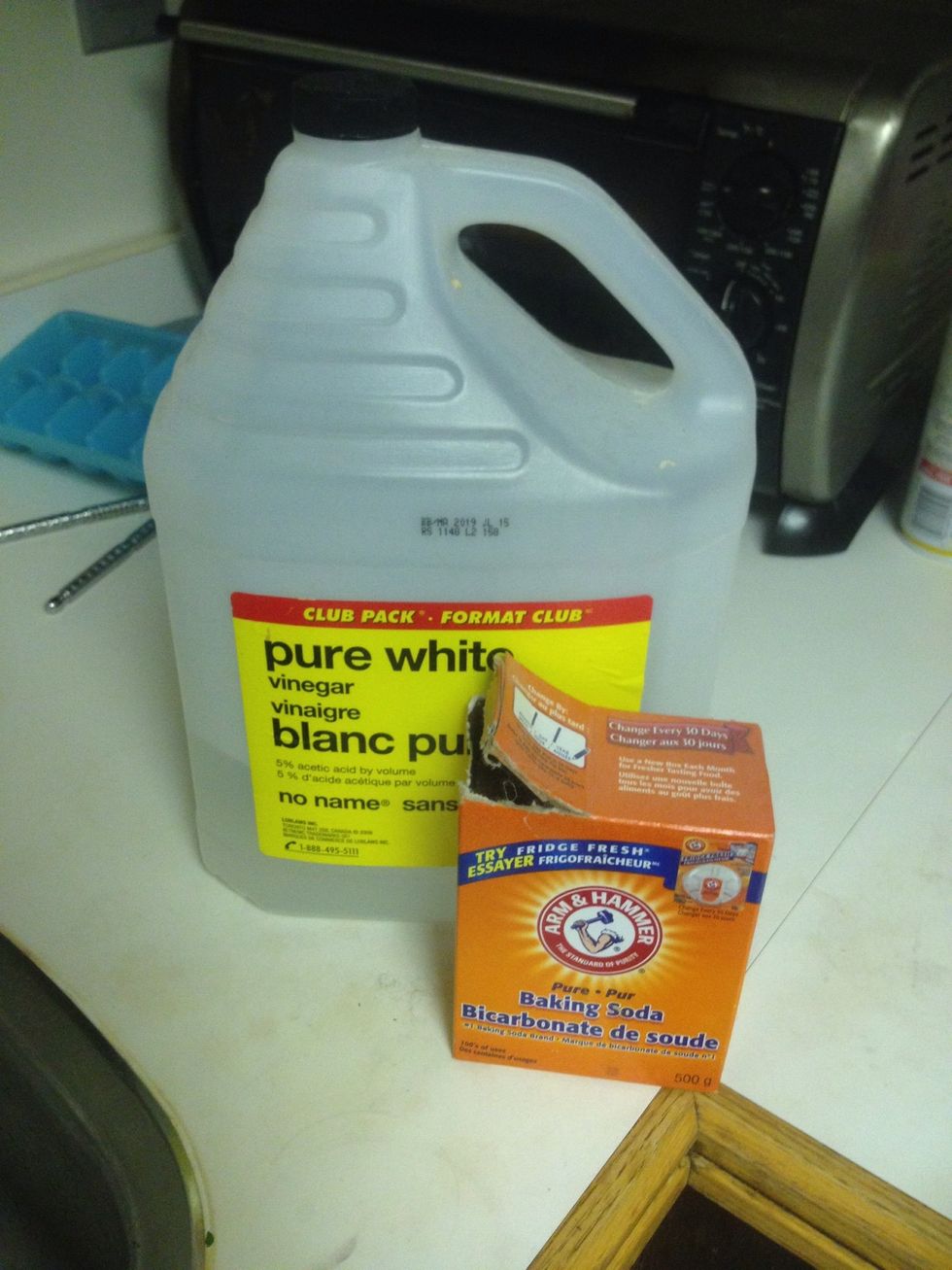 Here is all you need, baking soda and white vinegar are very cheap at most grocery stores. Go for the cheapest stuff, you'll literally be pouring it down the drain ;D