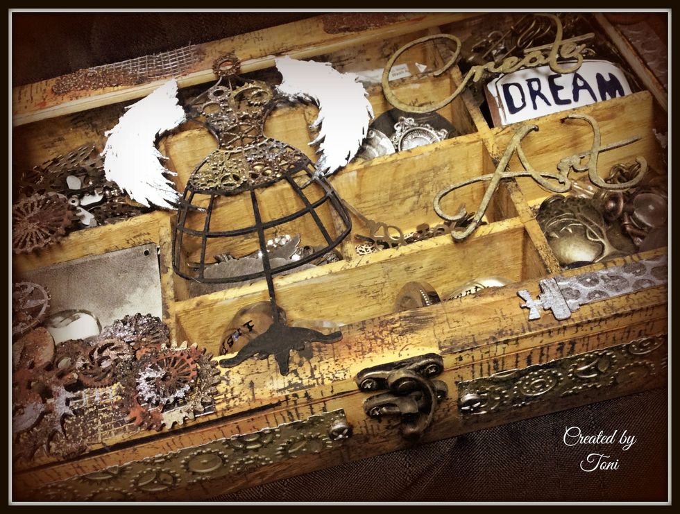 Here is another closeup that allows you to see how nice those Andy Skinner stamps give that cracked vintage look. The title was also painted with DI Stain Tarnished Brass.