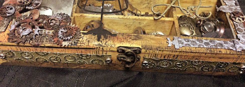 Here is closeup and I added little brads that looked like screws to the ends.