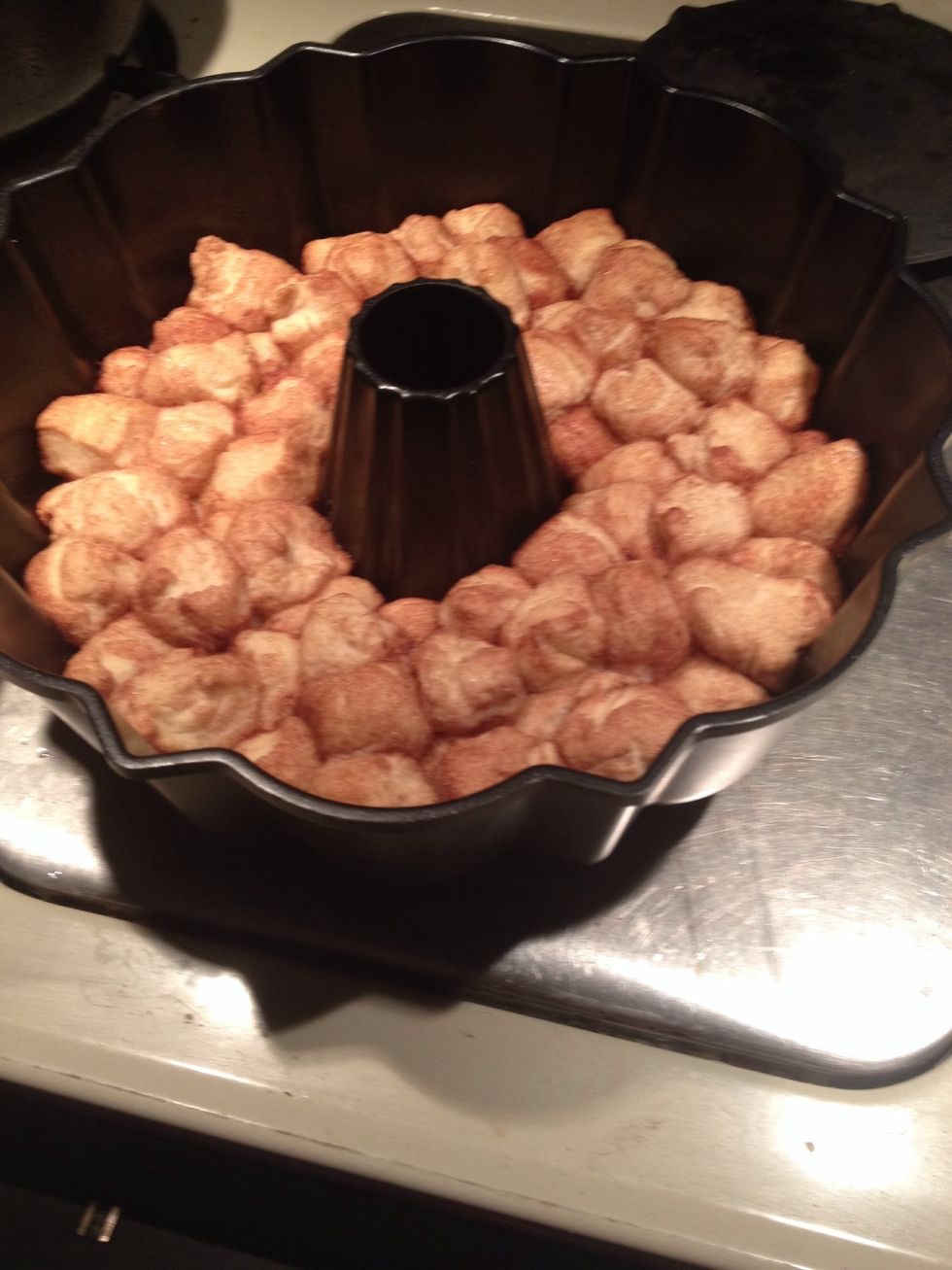 Here is my done monkey bread put on a plate upside down then kinda shake it it should come out clean if not it's ok just piece it back together