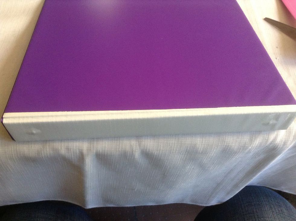 Here is my other side. Centering the tape will help cover and protect the binding and the binder and prevent "holes" in the duct tape cover.