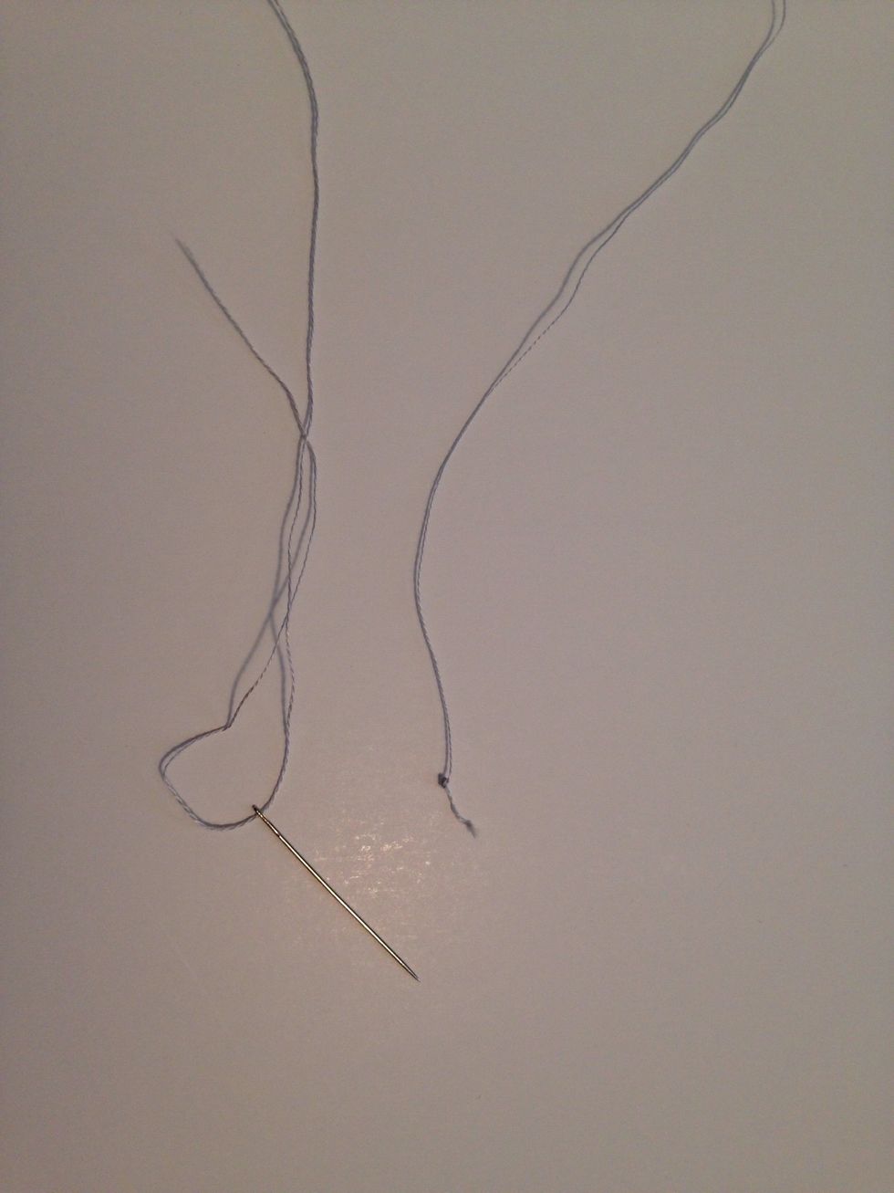 Here is my thread now threaded through my embroidery needle. Make sure to tie a knot at the end of the thread.