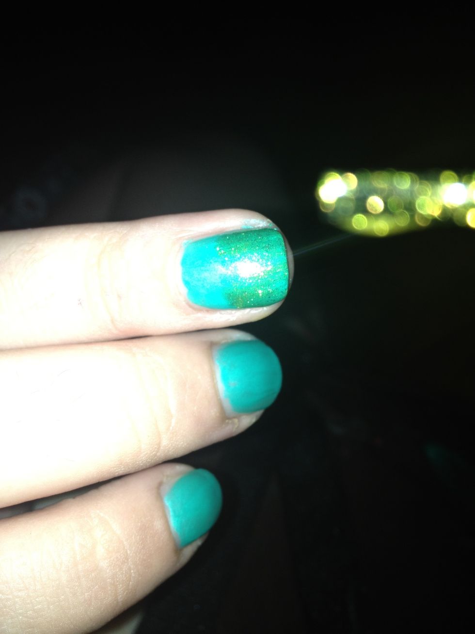 Here is my very sheer first coat. As you can see you can still slightly see my blue base cost, but you still see the sheer color lightly covering it. This is the effect you want.