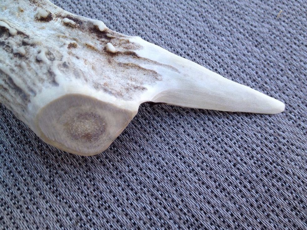 Here is the antler letter opener blade after I've finished with the rough sanding. The thickness of the blade can vary anywhere from 1/4 inch to 1/8 inch. Notice how I've made it taper.