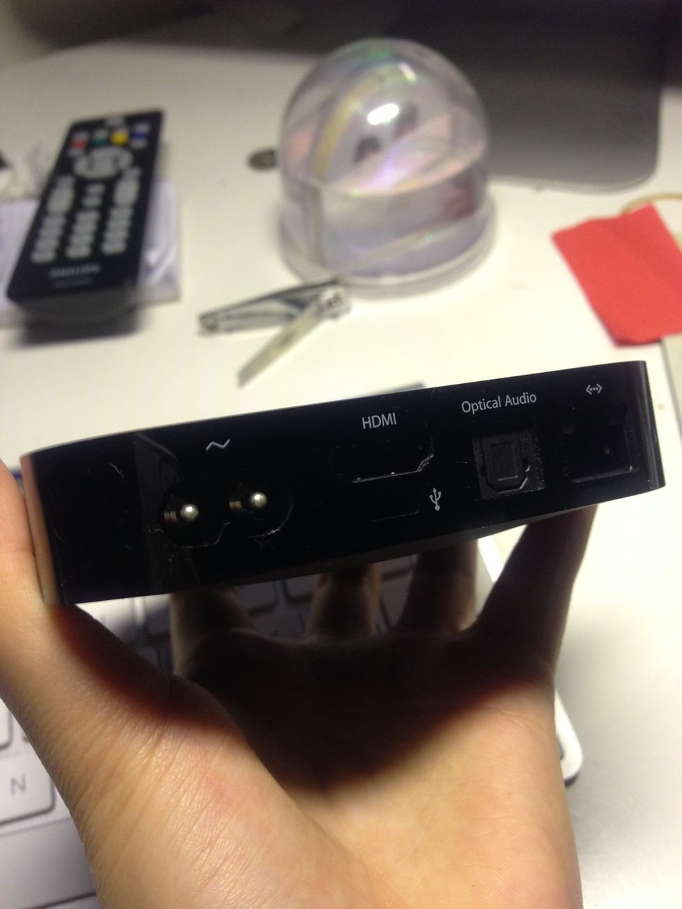 Here is the Apple TV brick. In the left is where the power cable is going to be, and right beside it is the HDMI, and that is where the HDMI goes.