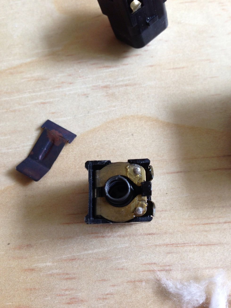 Here is the button sanded and greased. Put them all back together and you'll hopefully have working windows again! Refer to the blown up switch photo (step 8) to see how it goes back together.