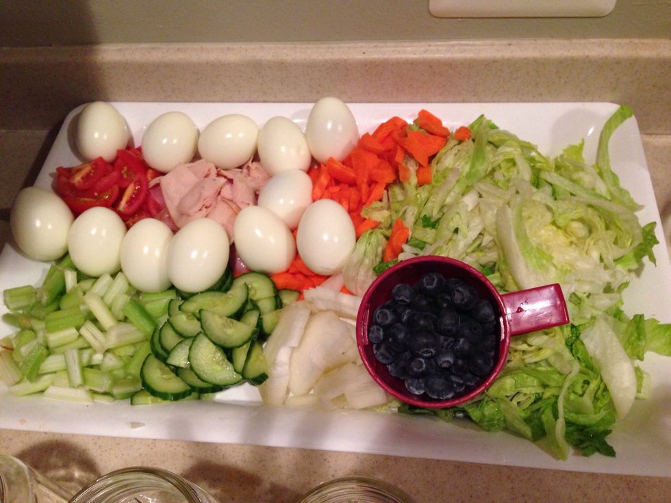 Here is the complete ingredients with blueberries and eggs. I just used the egg whites on my salad without the yolk so I had to cut my eggs in half and sliced it.