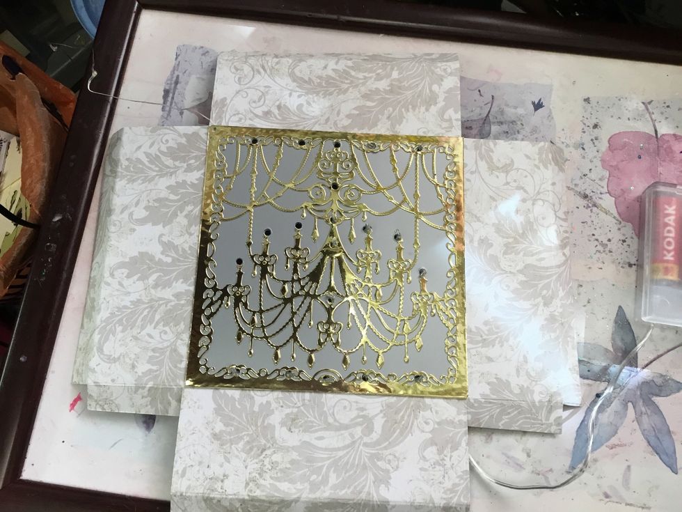 Here is the die stuck to the card that will form the box, which will hide the lighting wire and battery compartment.