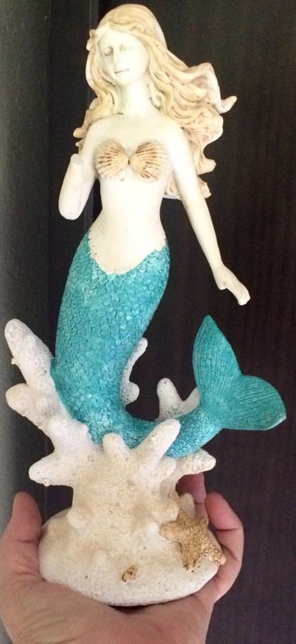 Here is the mermaid piece I am altering. Her hand is broken and she really is quite plain, but still beautiful