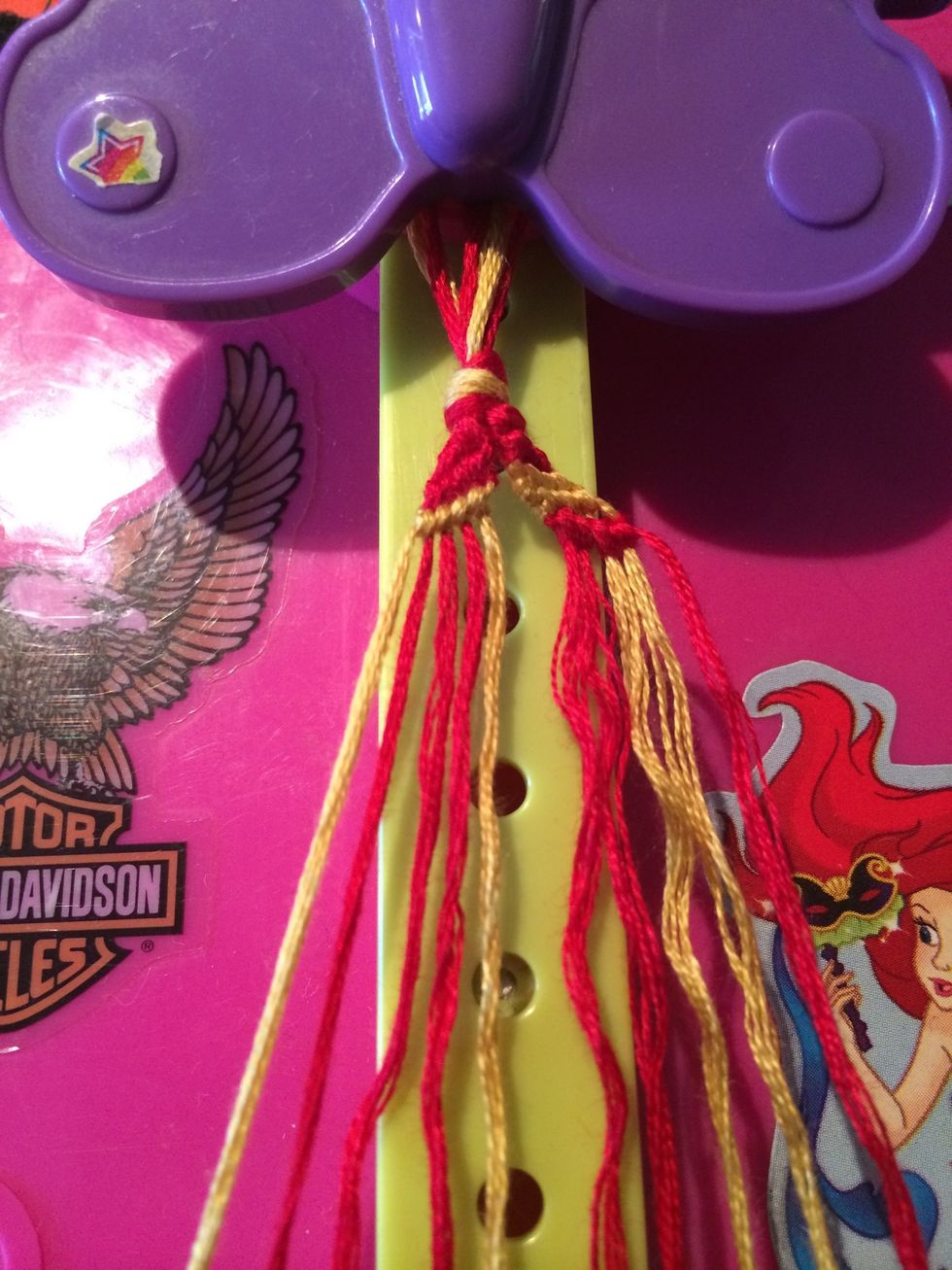 Here is the third row. After the second or third row it gets a little repetitive. Grab the next gold string and make your way across again.