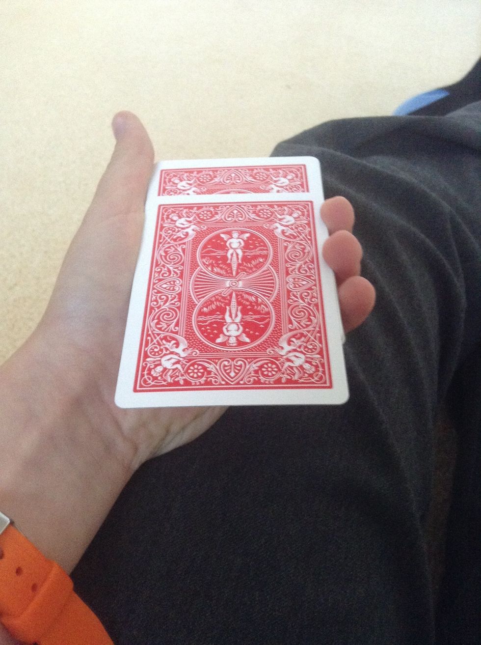 Here is the trick! Here, you take 2 cards, but you make it look like 1! This takes practice, but you can do it!