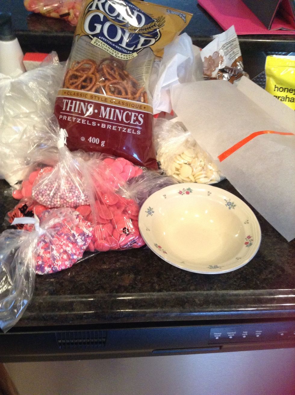 Here is what you need!\n \u2022A bag of pretzels\n\u2022Candy melts aka chocolate to melt\n\u2022Sprinkles\n\u2022Parchment paper\n\u2022A few bowls for chocolate