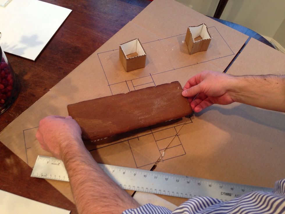 Here it goes. We're wondering why we didn't use sugar cookie dough because this is so dark. Then we remember- gingerbread house! Duh.