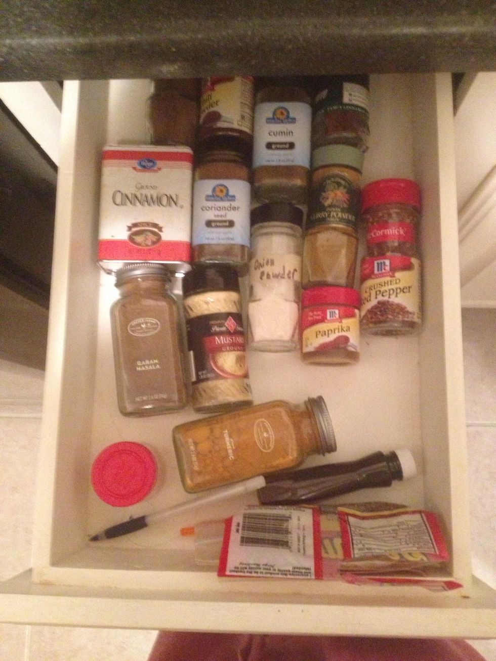 Here it is my drawer before. I like everything alphabetized, but w/ diff sizes, they slide. Look at vanilla & turmeric sneaking away together.