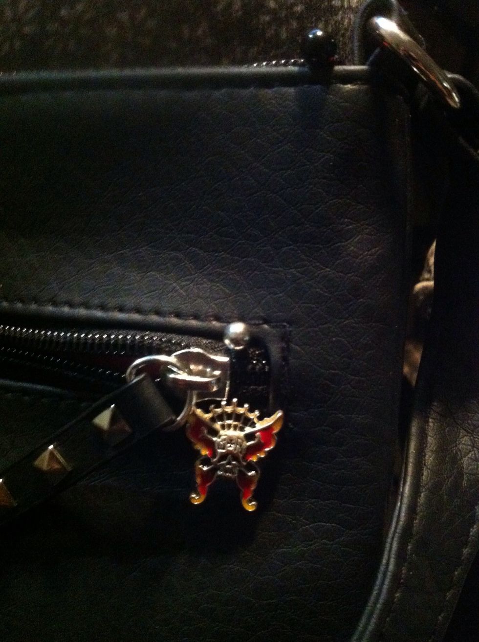 Here it's great as a zipper stopper for side zippers and doesn't stick out like it did sitting on top of the purse