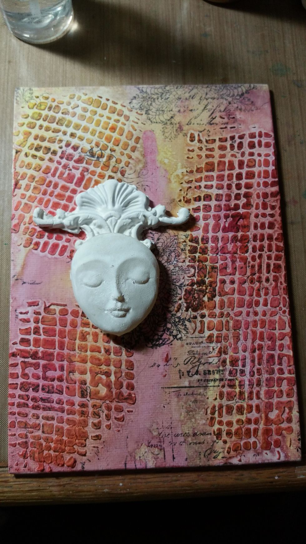 Here more color was added as well as my gessoed pieces to begin my focal point. Lightly spray water and move ink around slowly to get the desired look.