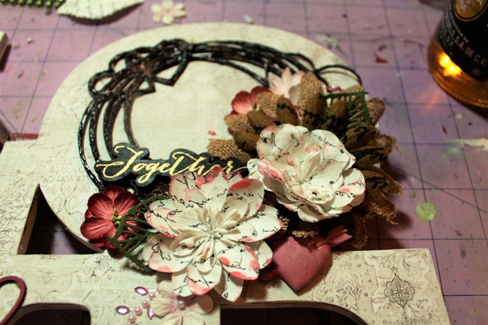 Here's a close up of the flower cluster. I hit the flowers with the Prima Glimmer Glaze here, too. A wooden Prima piece was tucked in the top and a Prima resin piece was tucked underneath.