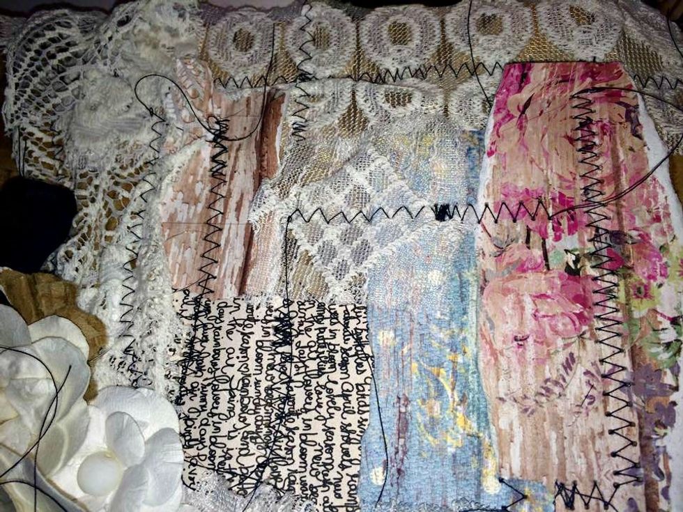 Here's a close up shot of leyers of papers and lace. I leave the long ends of my thread on most of the time. I like how it looks and it adds more texture and interest.