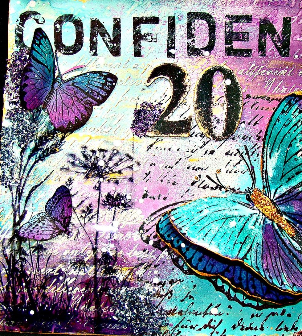 Here's a closeup of the stamped acetate that was applied using Glossy Accents to the page.