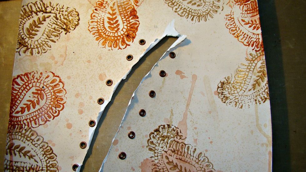 Here's a photo with the stamps and eyelets in place.