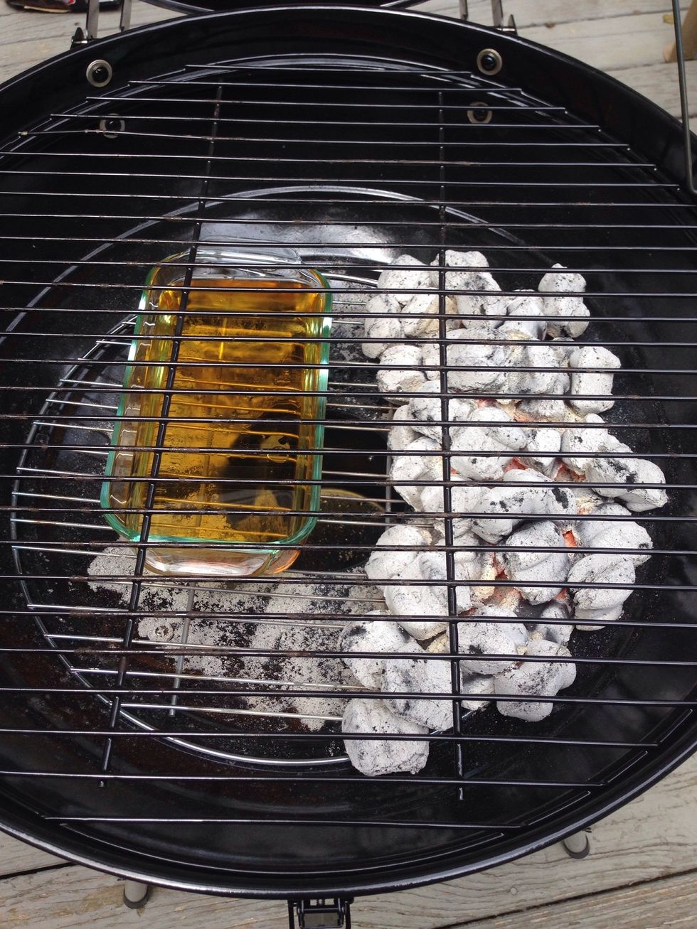 Here's a pro-tip: fill a small Pyrex dish with apple juice and set it across from your coals. The steam from the apple juice will help flavor the ribs... and it will be delicious!