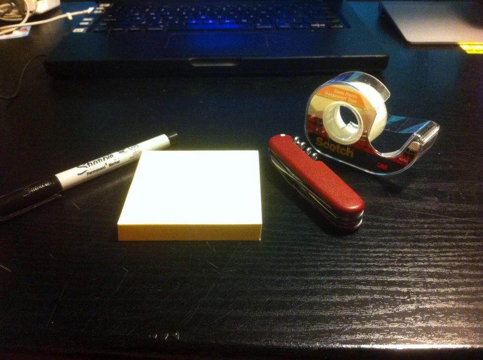 Here's all of my supplies. I used sticky notes, a pocket knife, an ultra fine point Sharpie, my Mac, and Scotch tape. I used an old tv stand as my cutting board. Go figure, I'm lazy.
