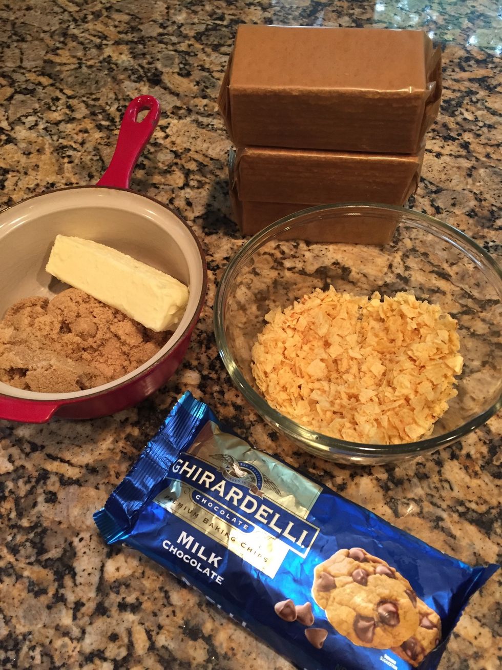 Here's all you'll need! 1 box graham crackers, 1 bag milk choc chips, 1 cup crushed plain pot chips, 1 stick butter and 1cup brown sugar