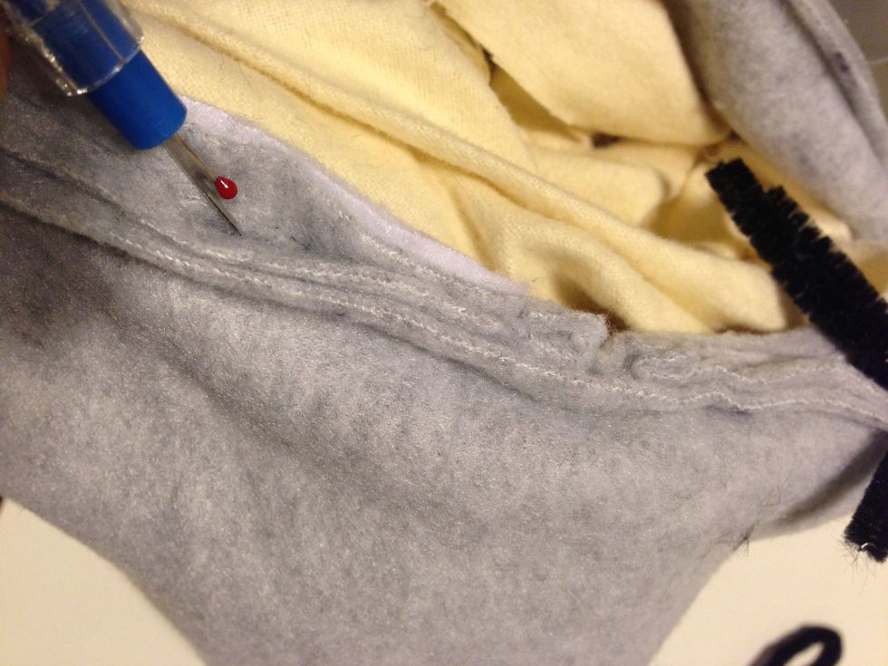 here's another tricky part. If u want to leave the ears down like Disney eeyore then skip this step. I wanted the ears to point up. Take a seam ripper & make a small opening where we put the stem in