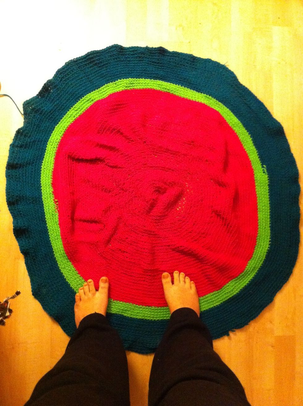 Here's another where I added colors, feet for scale. :). For that, just grab the tail of the other color yarn and drop yours and continue on. Easy enough once you start. It could be a rug too?