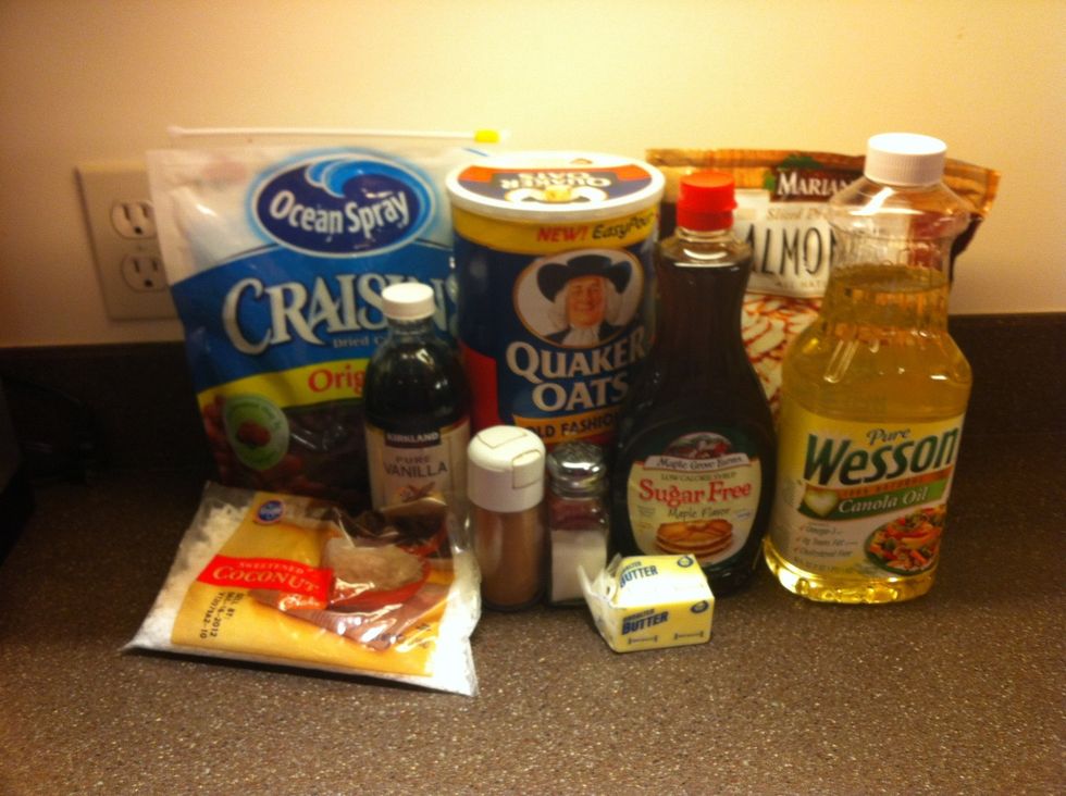 Here's everything I used for this batch. 6 c. Oatmeal, 2 c. dried cranberries, 1 1/2 c. almonds, 1/2 bag shredded coconut, 1/4c oil, butter, vanilla, 1 1/2 c sugar free maple syrup, cinnamon, & salt.