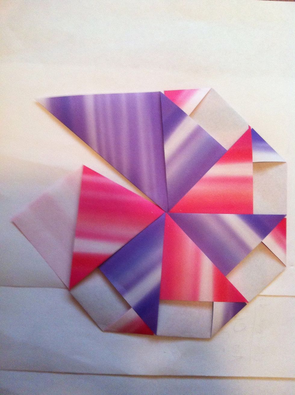 Here's my 6. You'll have a gap which is good cuz you're making a cone. Pink is going to slide into purple. Tuck away those two triangles & you're done!