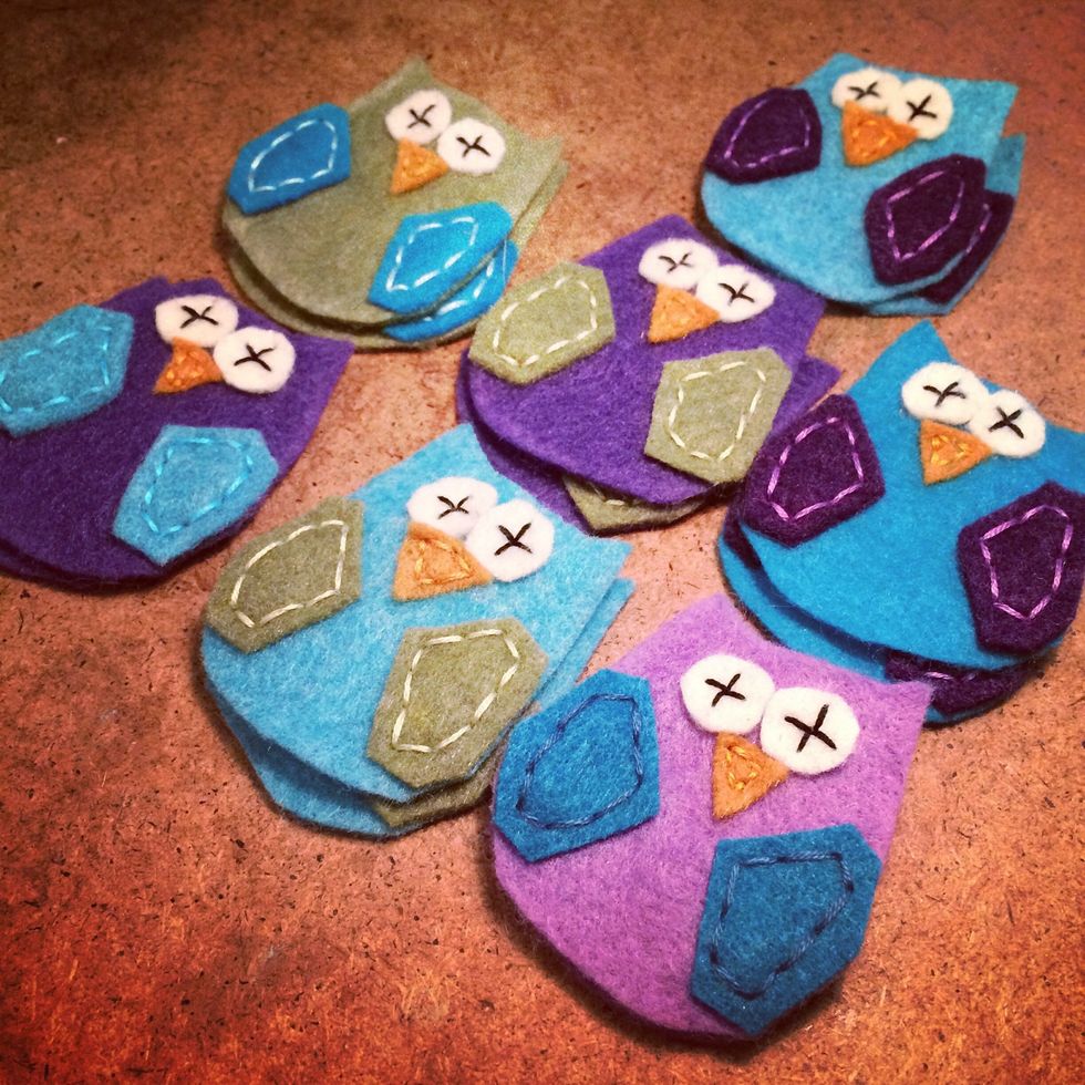 Here's my felt appliqu\u00e9 owls so far. It's easy to stitch an assembly line if you're making more than one pair of booties.