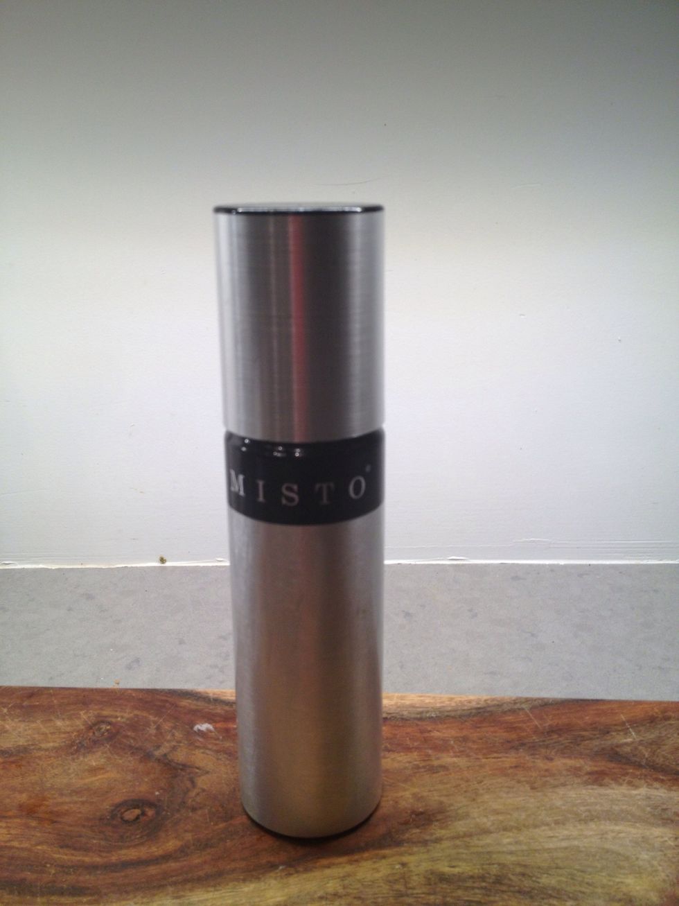 Here's my little friend, the Misto. Put any kind of oil in and pump it up-- it creates a nice spray without any added chemicals. (If using coconut oil warm it first to liquefy)