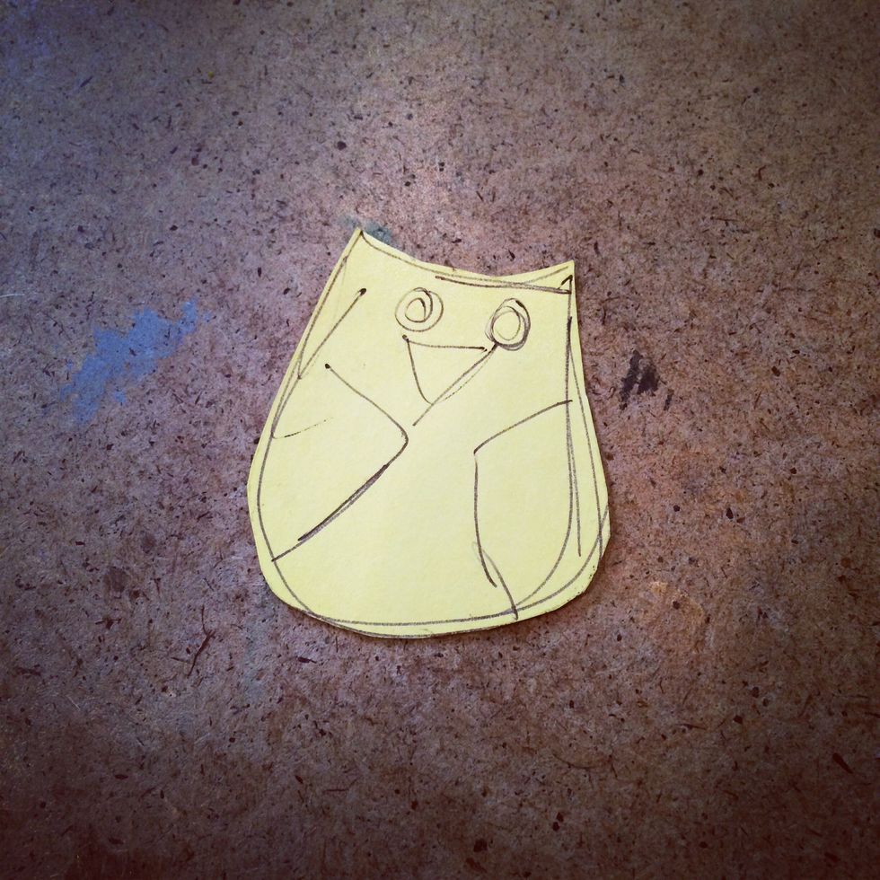 Here's my pattern for the owl that I'll be stitching to the toe of the booties. I usually draw out my idea roughly then cut it out.