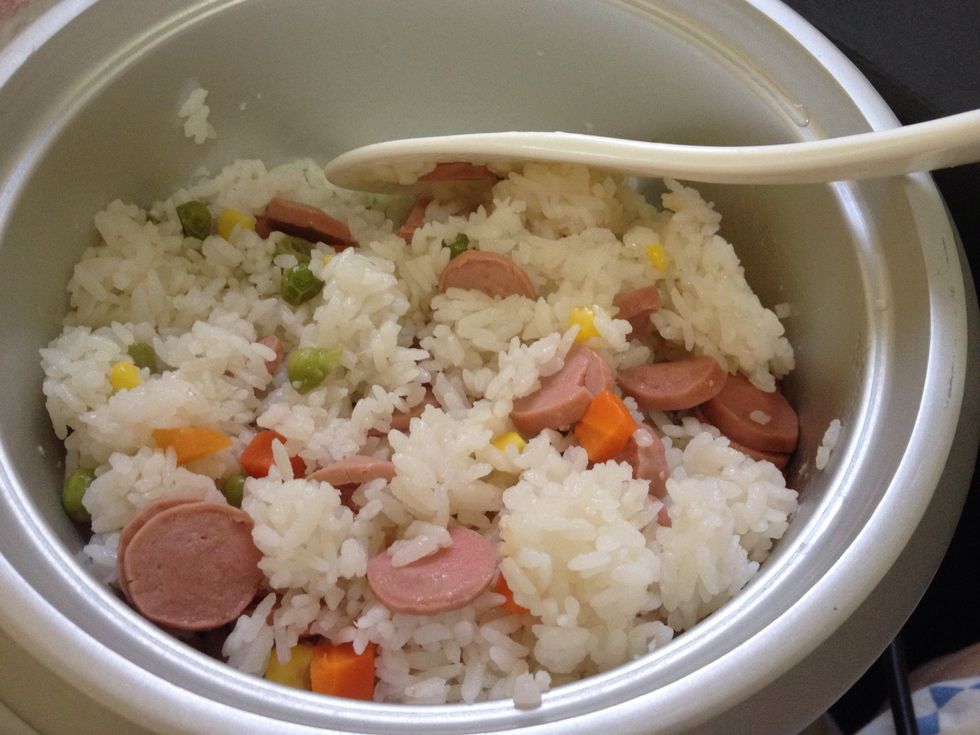 Here's our rice! Very easy to cook, simply add mixed cut vegetables and sausages into the the rice, remember to add about 1/4 cup more water as the sausages and vegetables absorb water. Add salt.