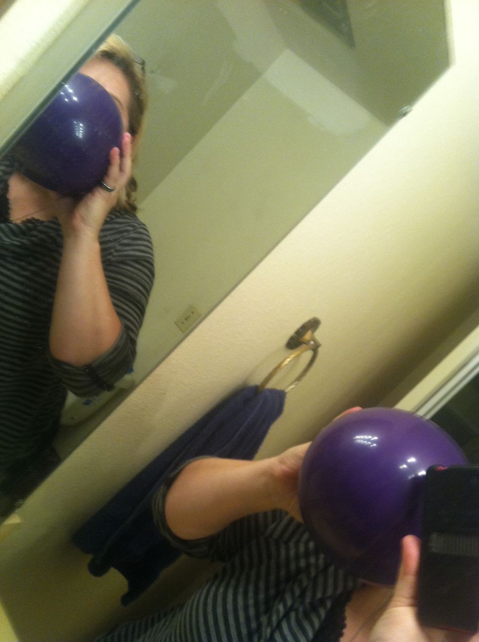 Here's the hard part, take a breath and inflate the balloon, but being careful not to let the water out. This part is tricky! Proceed with caution! (maybe use pump w 2 people)