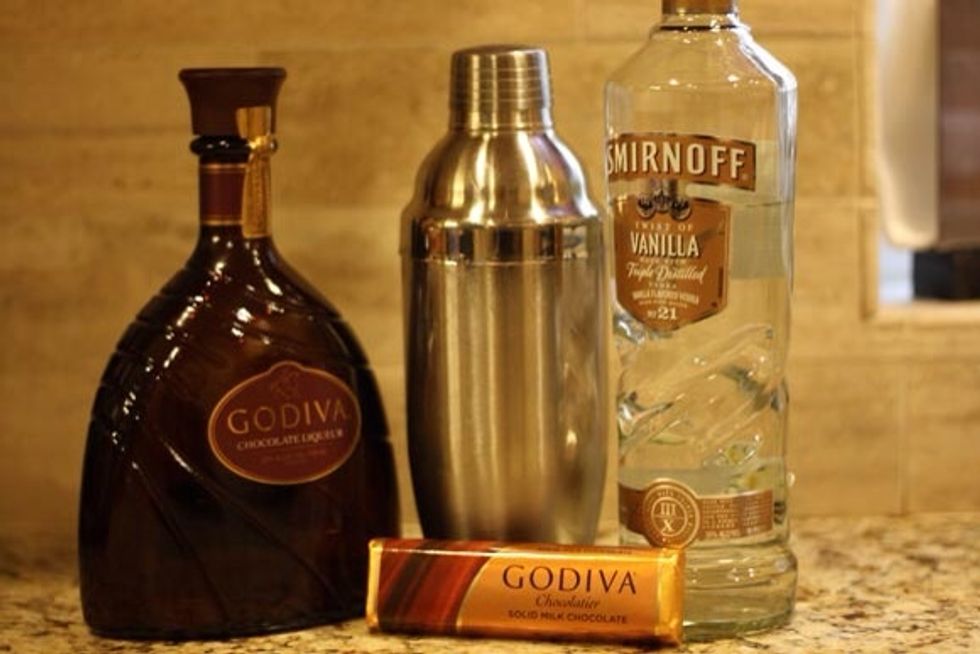 Here's the liquor you'll need! 1\u20e3 ounce Godiva, 1\u20e3 ounce Vanilla Vodka. 1\u20e3ounce chocolate syrup! Put mixture in a shaker over ice and shake that bad boy for 15 seconds.