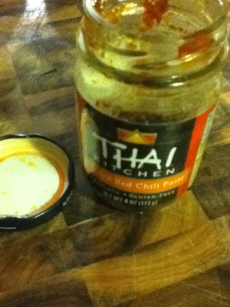 Here's the M. Night Shyamalan twist! I found this in the fridge. It's Thai-style roasted red pepper paste. I only have 1 small spoonful left in the bottle, not enough for anything else. Let's add it.