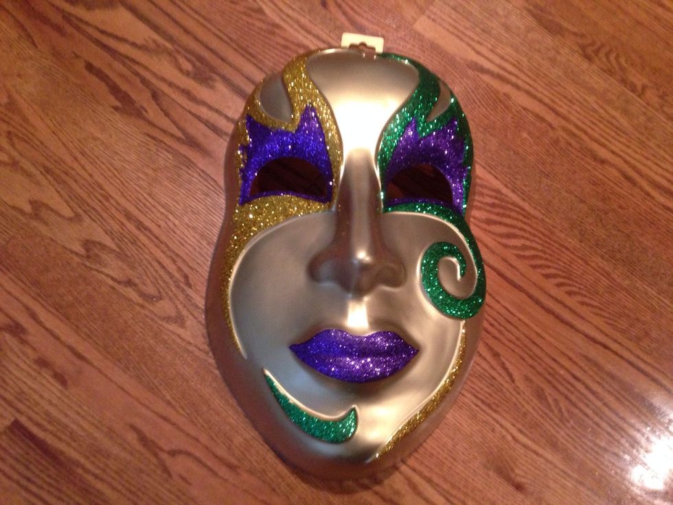 Here's the main attraction.  A giant mask about 21 inches long available at your local party supply store during Mardi Gras season.