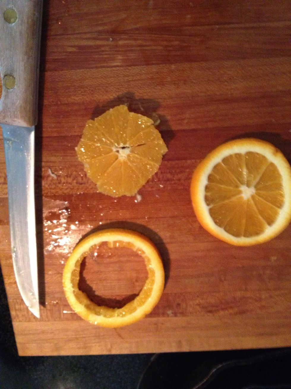 Here's the sloppy part. Slice an orange. Take two slices. Cut the center out of one & cut into bits similar to the celery/chicken. Stir the cut up orange into the pan.