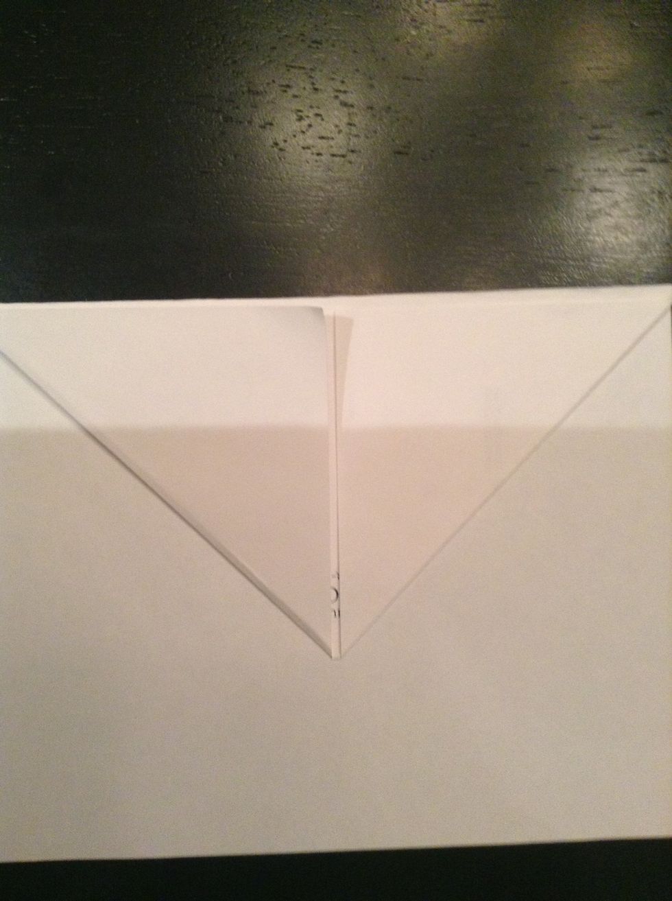Here's the tricky part: flip the paper over, THEN, fold it back