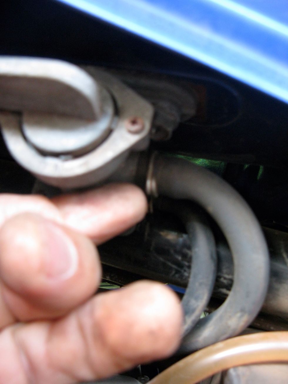 Here's two more hoses. Get the pliers again. Move the clip and slide em off. Probably gonna be some fuel spilling out