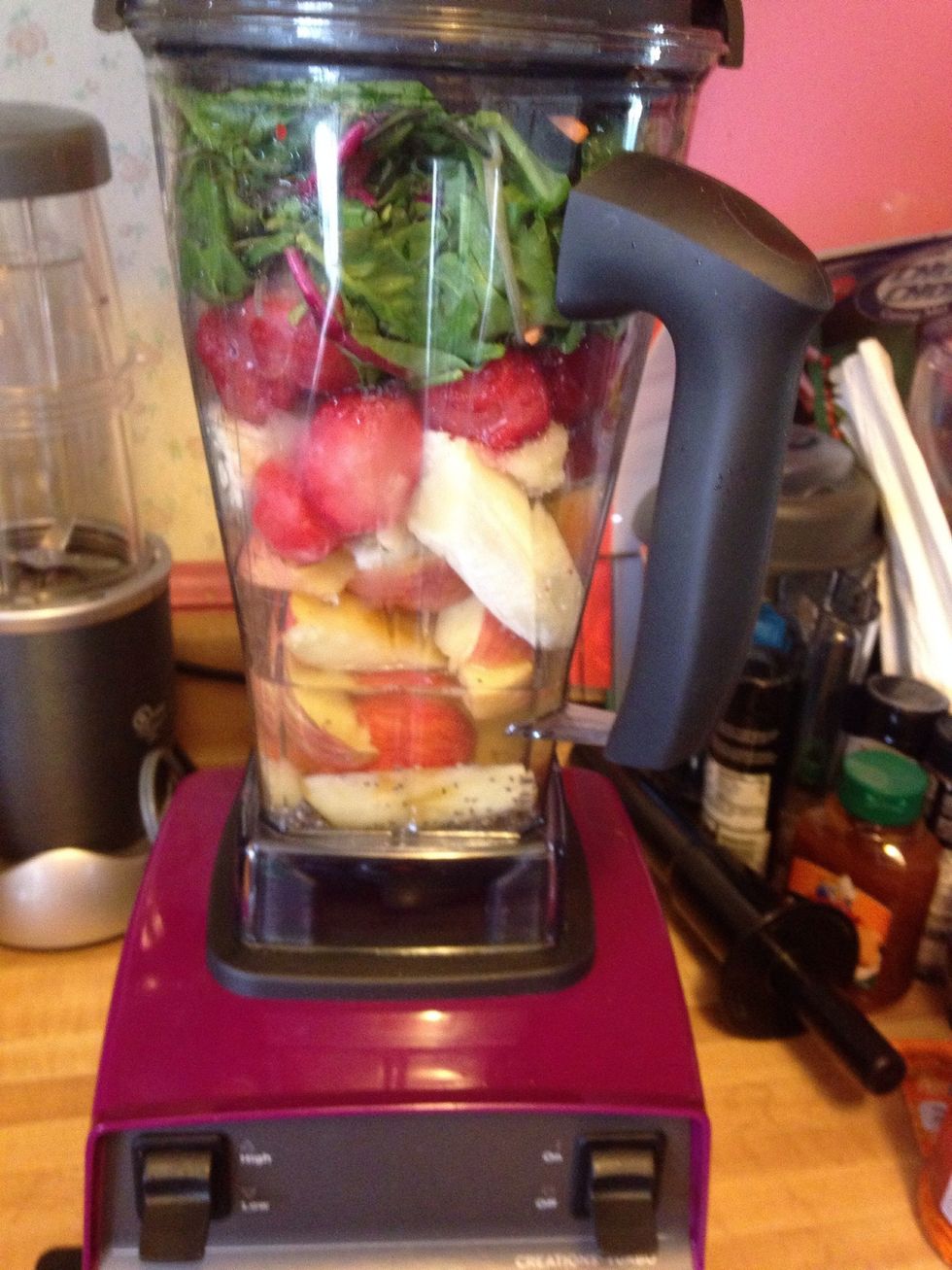 Here's what it looks like in the blender. I know I added the frozen strawberries before the spinach, I learned after making it. Lol