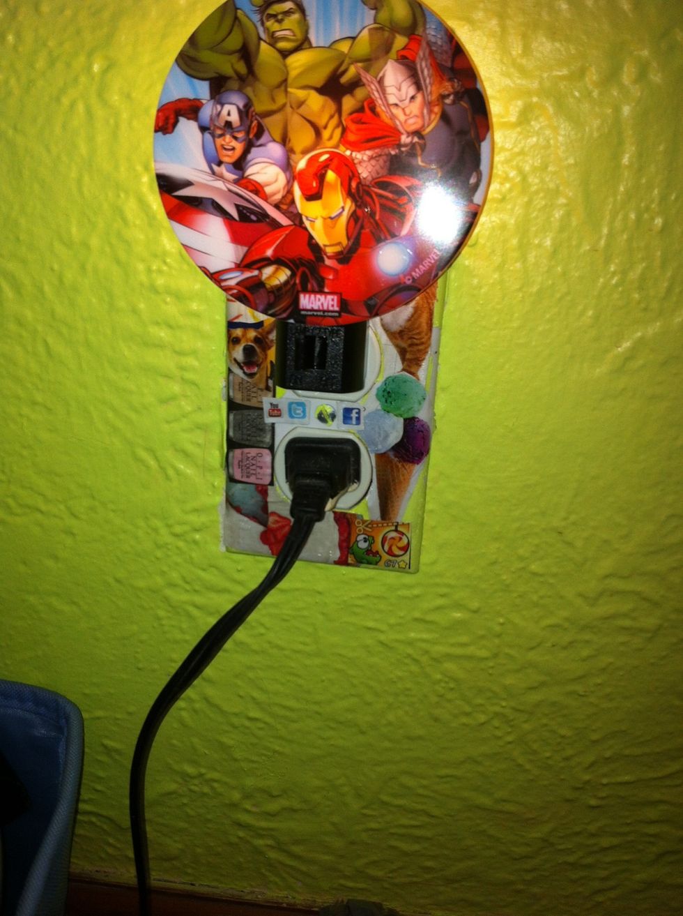 Here's what it looks like with my stuff plugged in. (And yes I am a girl who likes marvel get over it:)) (the night light is for my guinea pig, so she can see her food and cage during the night)