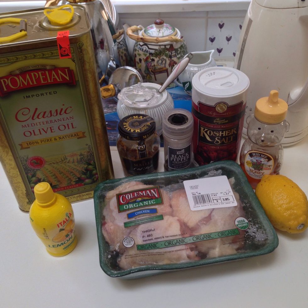 Here's what you need: chicken thighs, lemon/lemon juice, olive oil, grainy mustard, honey, pepper, and salt.