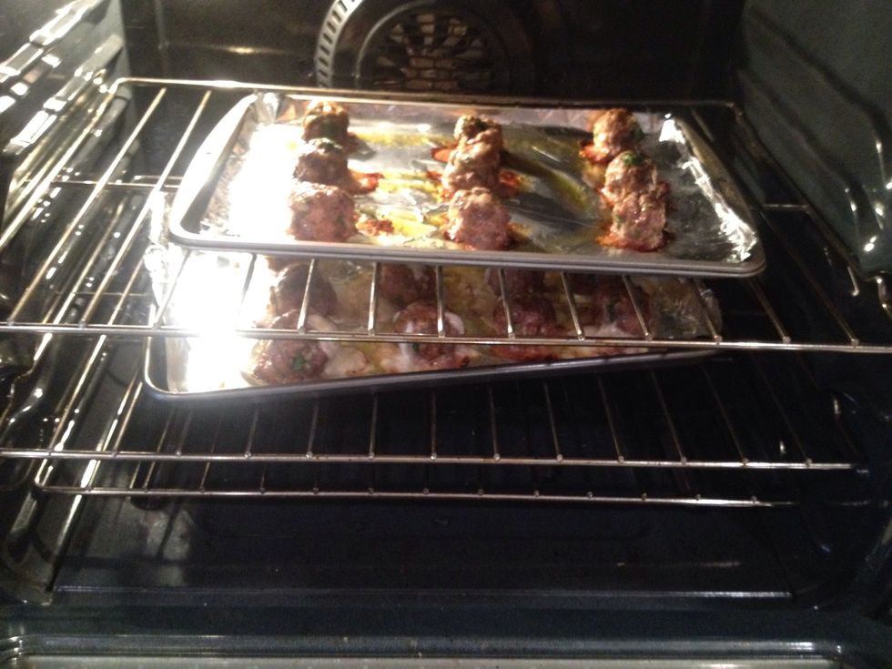 Here they are baking away. A lot of mozzarella runs out, but there is still cheese inside.